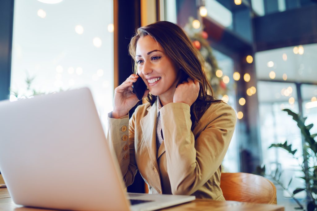 Your current customers are your best asset. With acquisition costs on the rise, Canadian businesses must find smart ways to keep their customers engaged and satisfied - woman at desk on the phone looking at computer