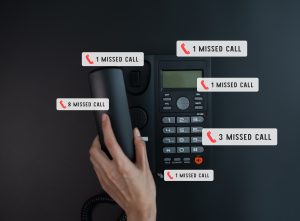 hand holding phone and notification message screen missed calls - showing the negative impacts of missing calls for businesses